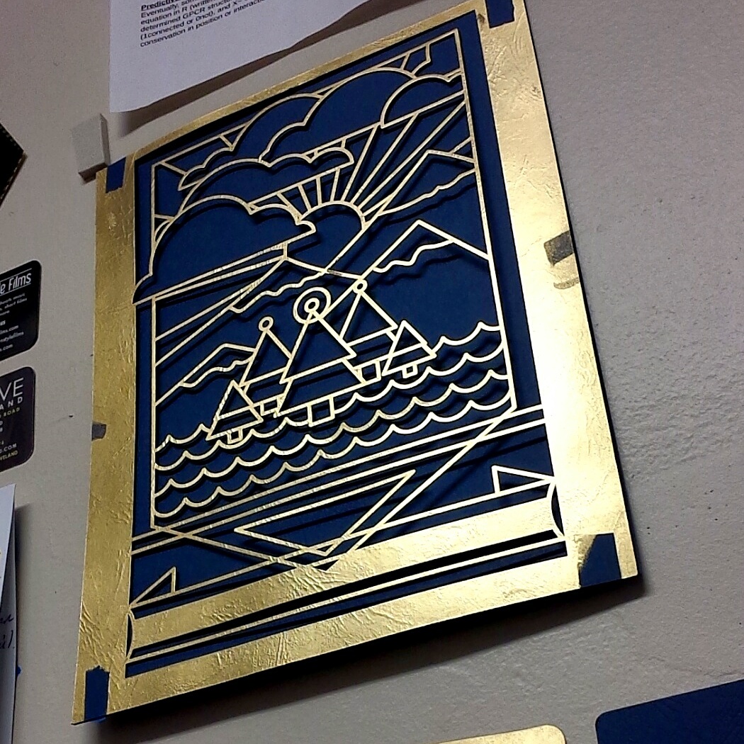 Laser cut poster on wall.